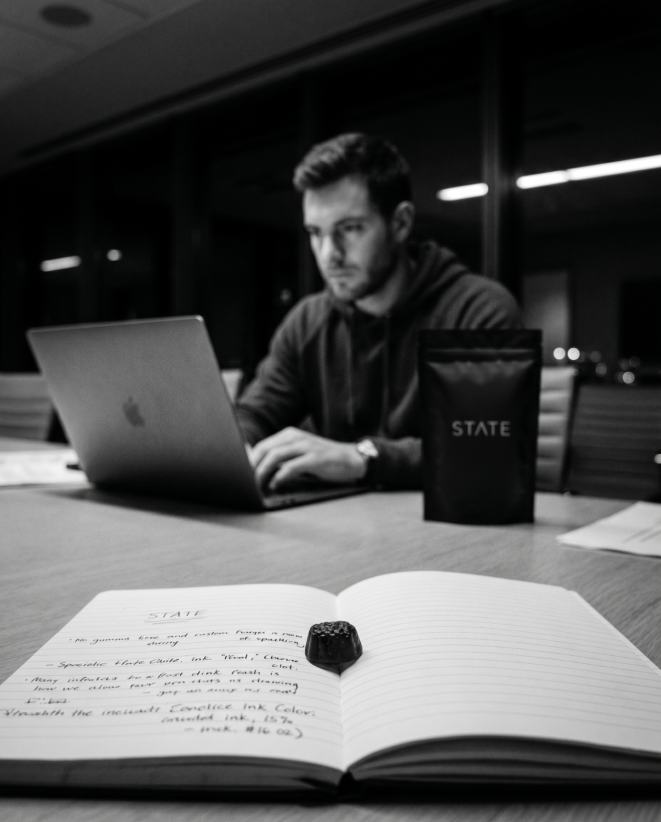 Founder working late at his desk with STATE